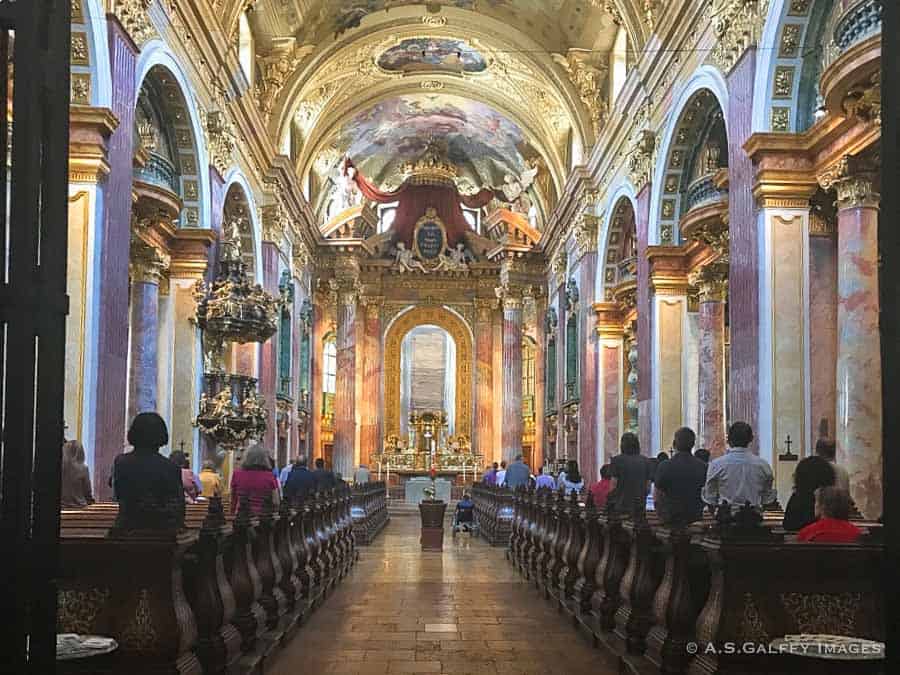 The brightly decorated nave of the Jesuite Church in Vienna