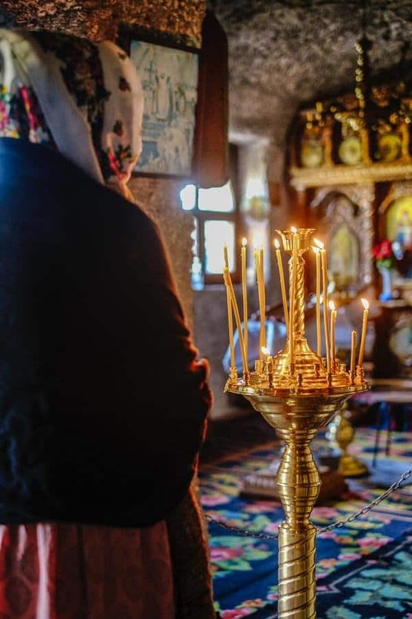 woman praying in an Orthodox Church
