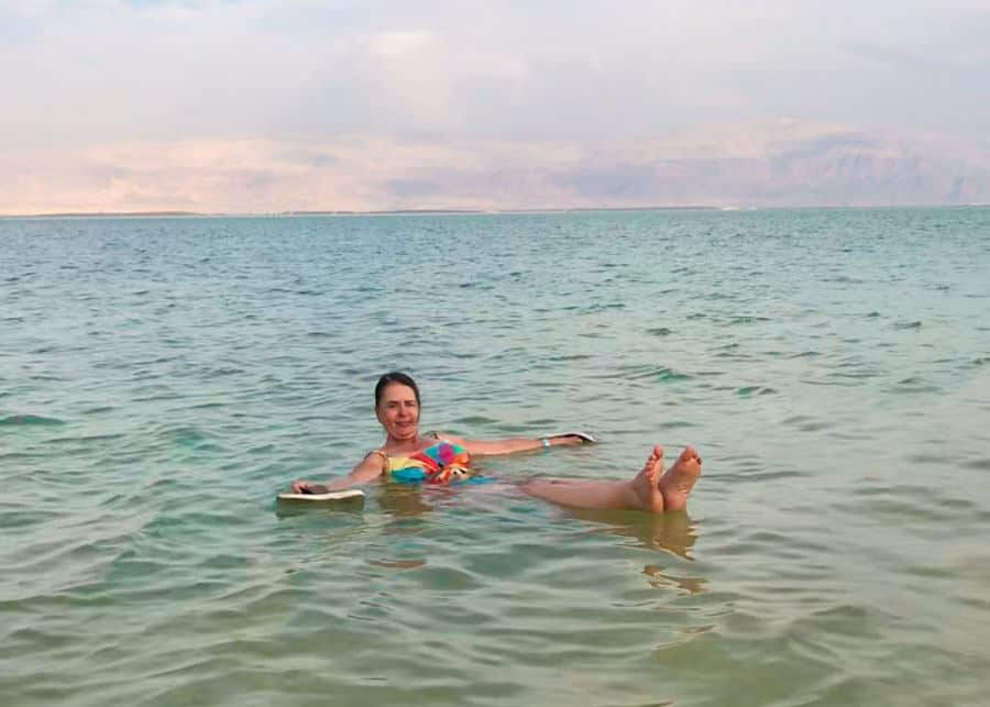 floating in the Dead Sea on a day trip from Tel Aviv